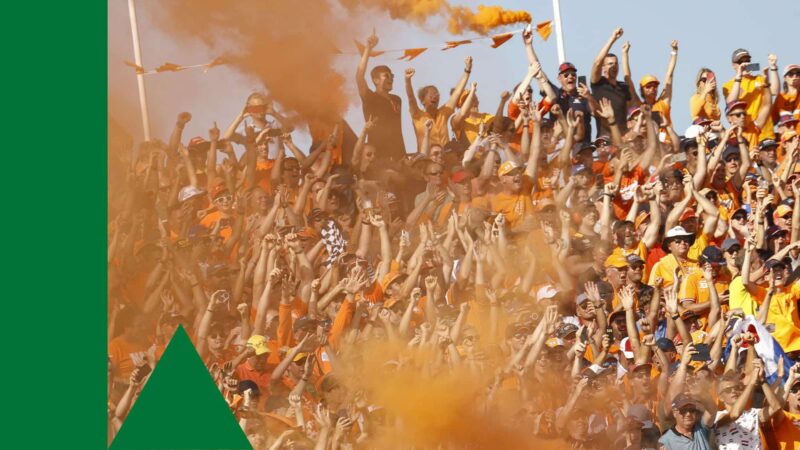 ZANDVOORT- Fans celebrate after the Dutch Grand Prix won by Max Verstappen at the Zandvoort circuit. ANP VINCENT JANNINK (Photo by ANP Sport via Getty Images)