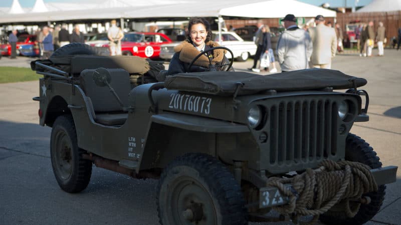 CHICHESTER, ENGLAND - SEPT 7th: Stylish young lady in fur lined flying jacket driving military vehicle/jeep during the 20th anniversary of the Goodwood Revival at Goodwood on September 7th 2018 in Chichester, England. (Photo by Michael Cole/Getty Images)