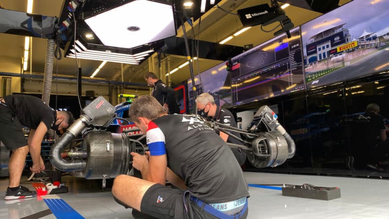 Alpine F1 mechanics at work in the garage