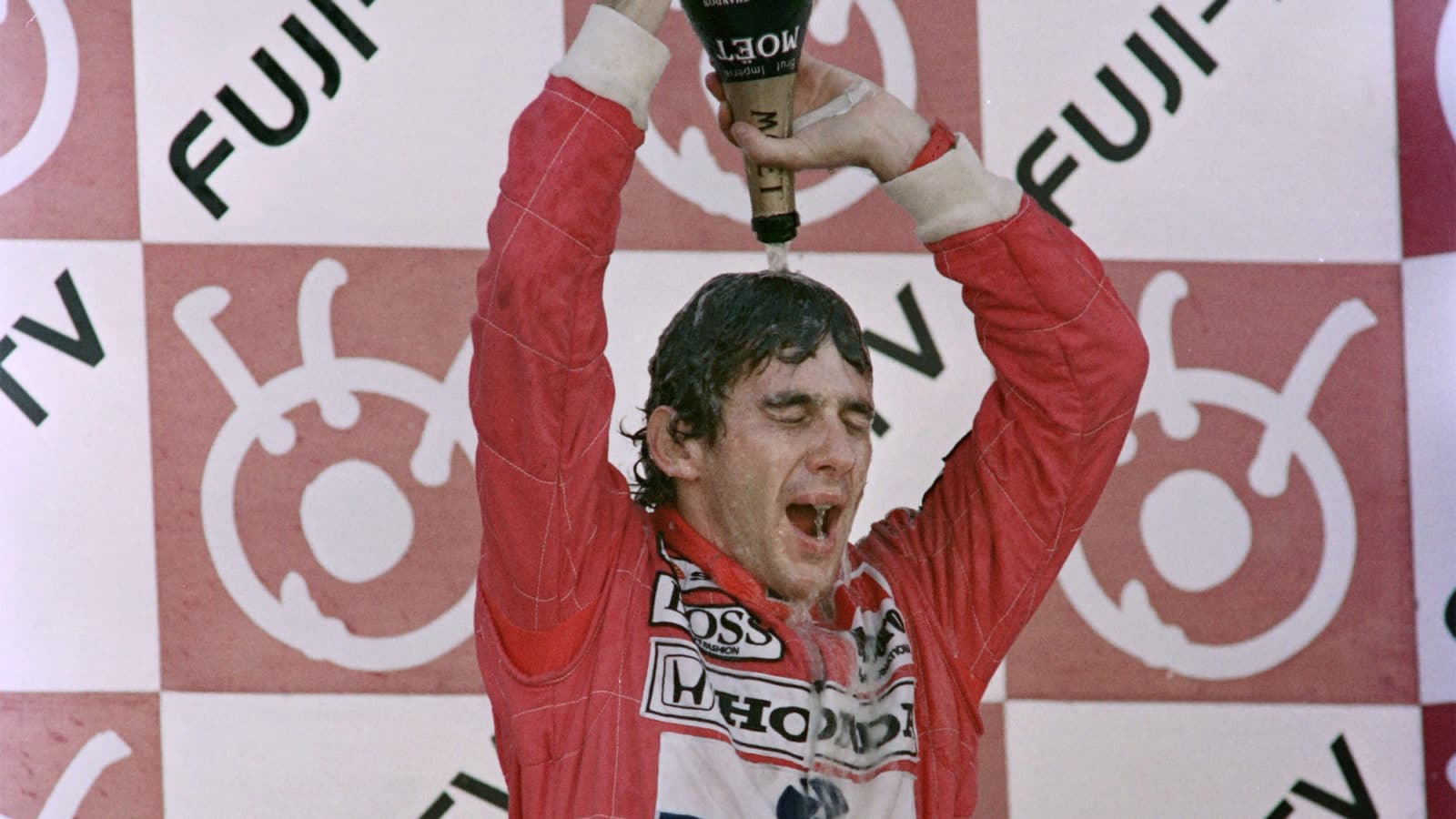 Ayrton Senna pours champagne over his head at Suzuka 1991