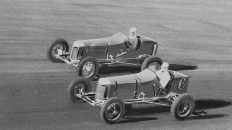 Bob Carey passes Ernie Triplett in the 1933 100-mile classic