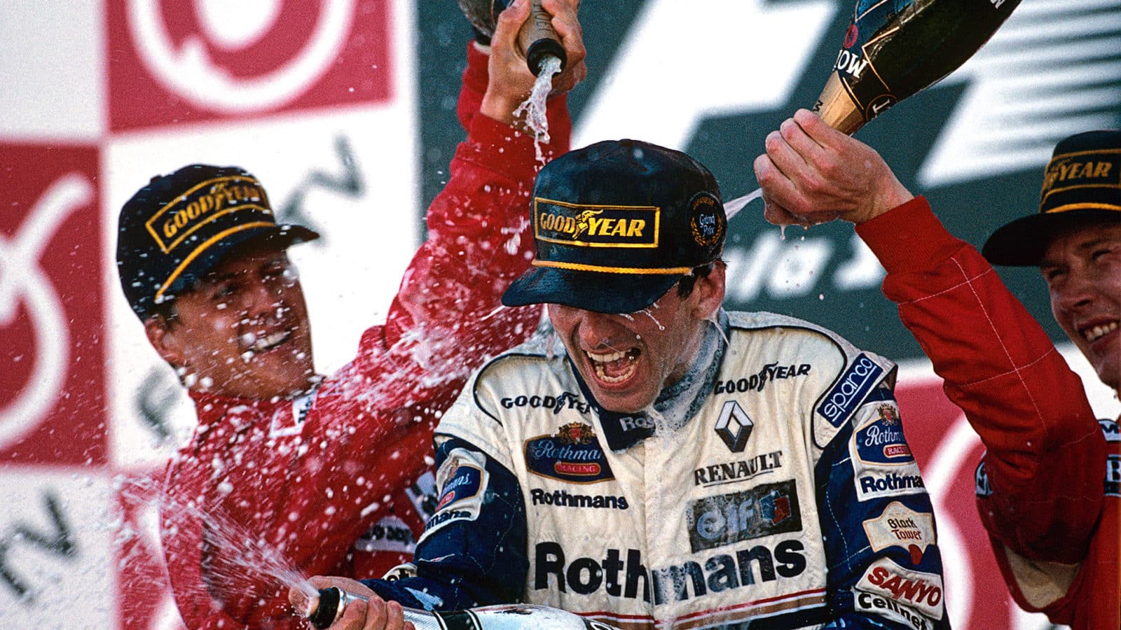 Damon Hill sprayed with champagne on the Suzuka podium in 1996