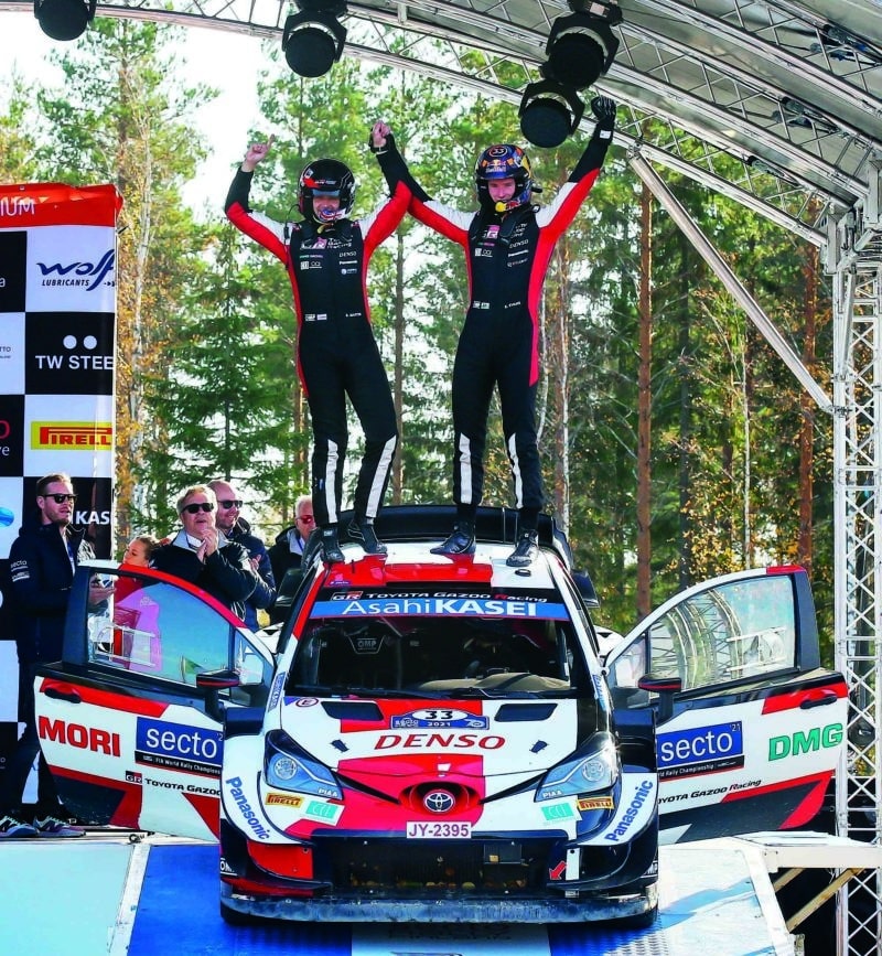 Elfyn Evans celebrates Rally Finland win