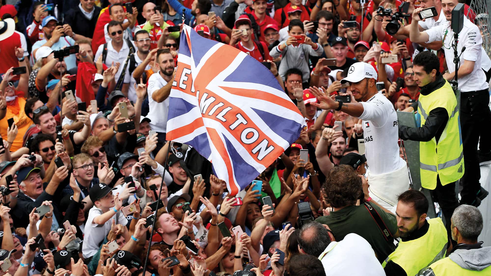 Lewis Hamilton celebrates with fans after winning the 2018 Italian Grand Prix