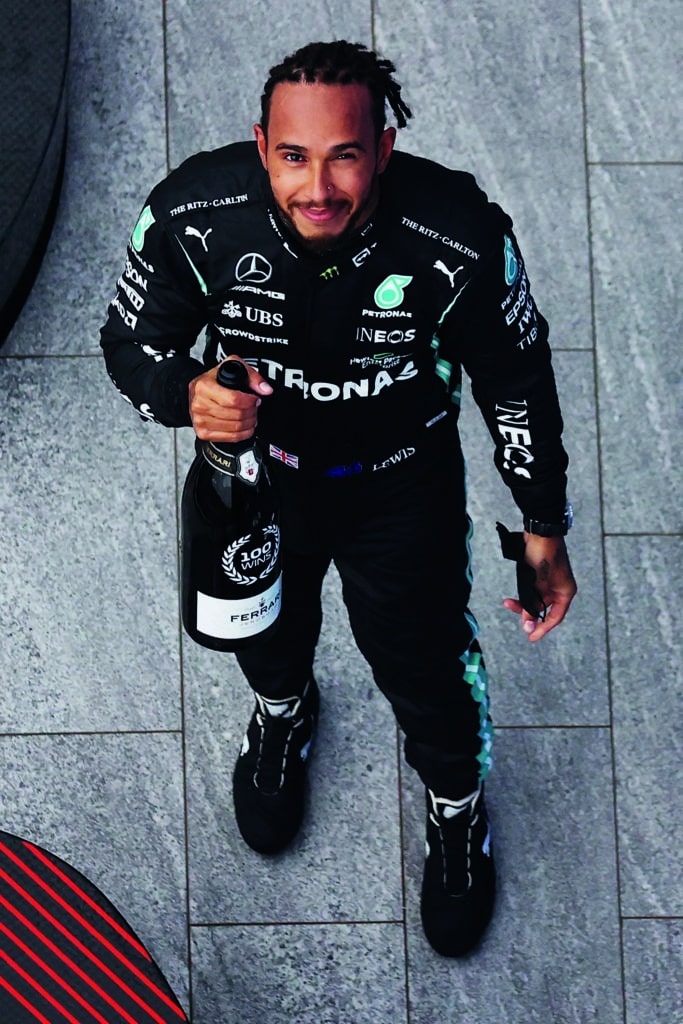 Lewis-Hamilton-holds-bottle-of-champagne-after-winning-his-100th-grand-prix