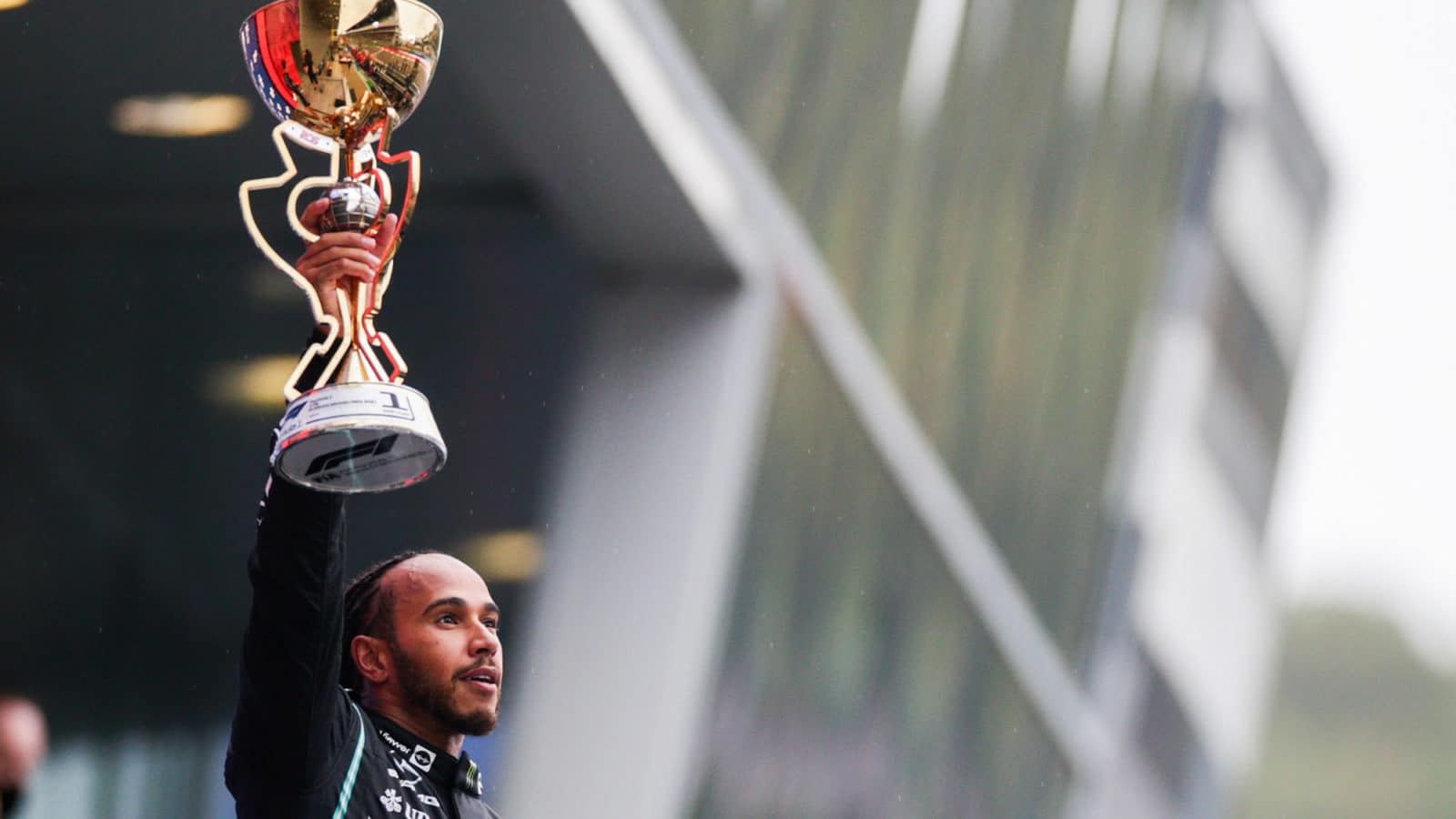 Lewis Hamilton holds the winning trophy after his 100th win in the 2021 Russian Grand Prix