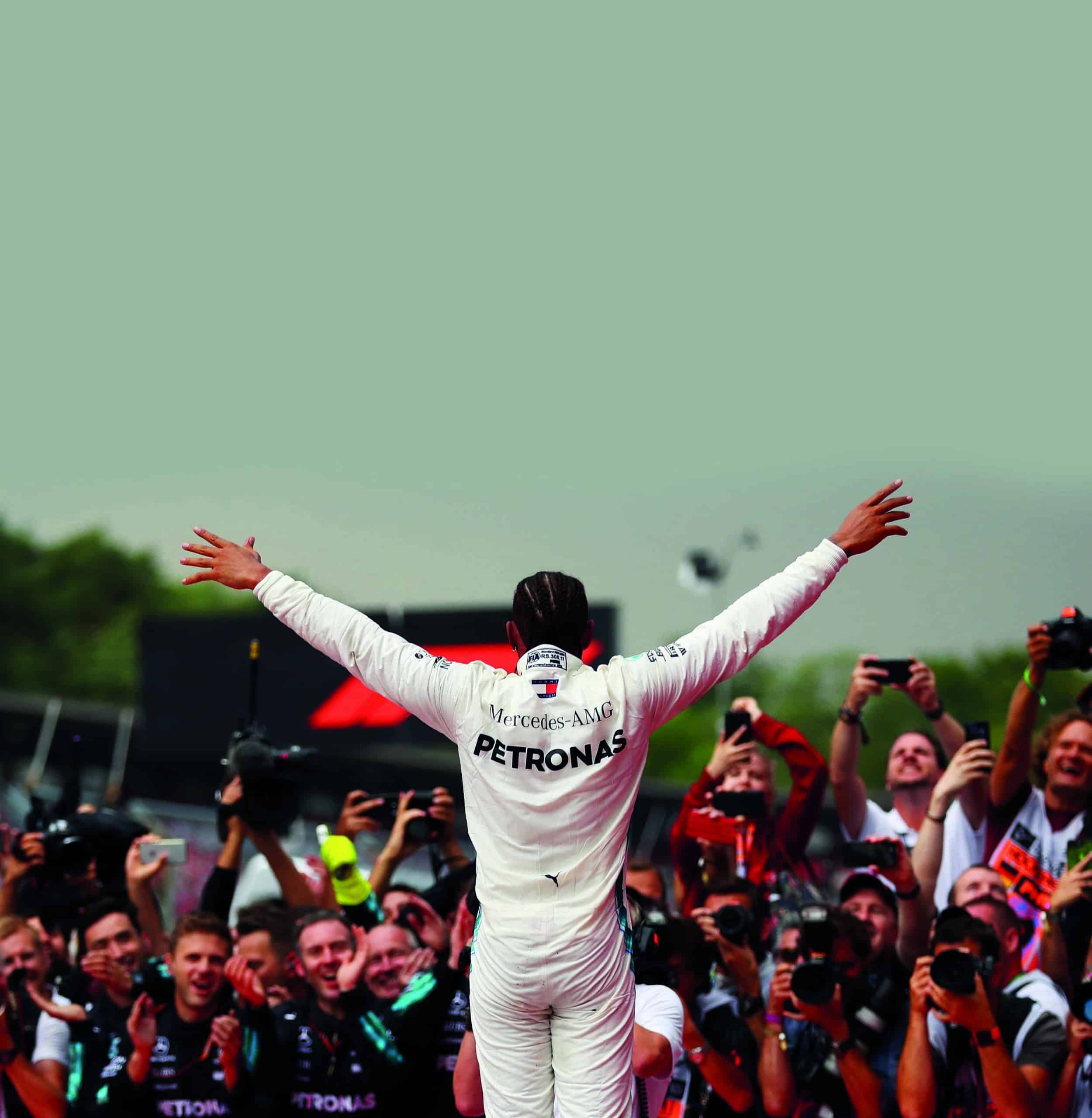 Lewis-Hamilton-raises-his-hands-in-front-of-photographers-at-the-2018-German-GP