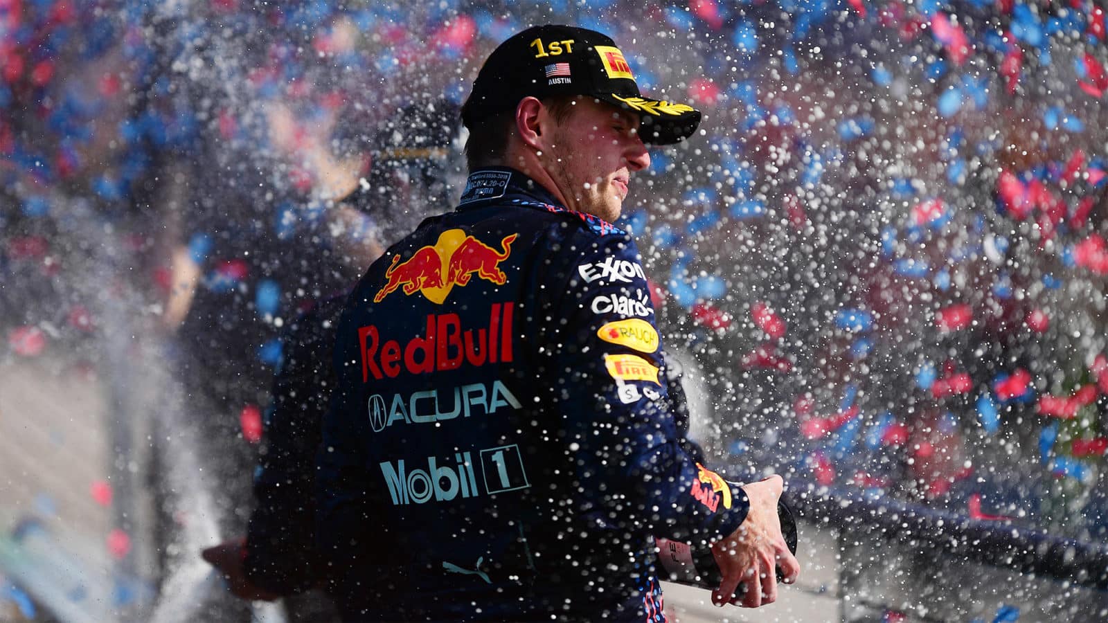 Max Hamilton sprays champagne on the podium at the 2021 US Grand Prix