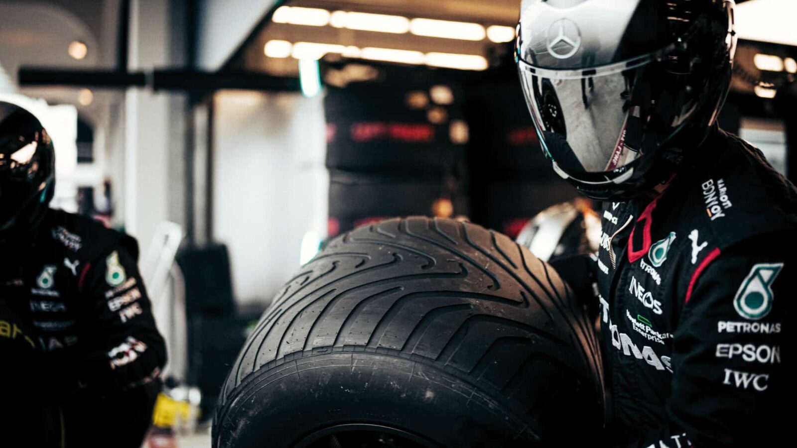 Mercedes mechanic with intermediate F1 tyre