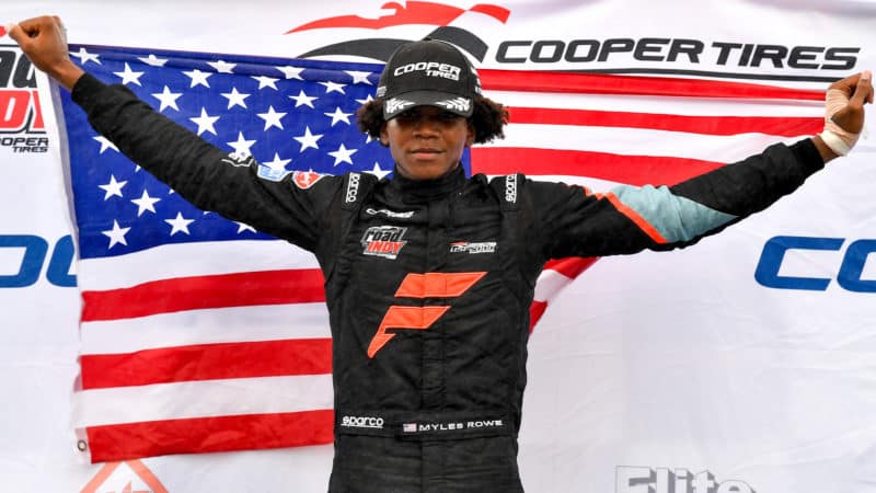 Myles Rowe holds the US flag after winning USF2000 in New Jersey