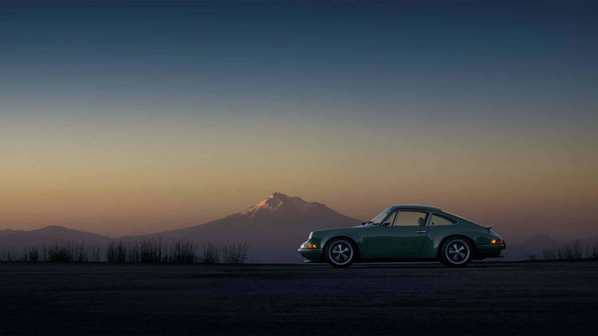 Porsche 911 with mountain in background