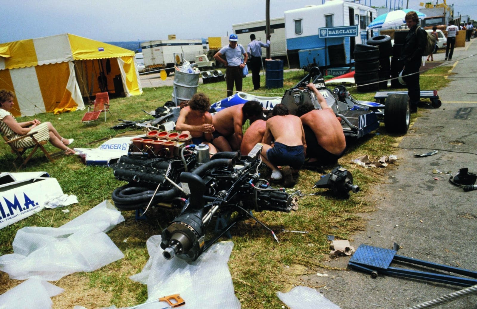 Shirtless-Osella-mechanics-work-on-stripped-down-F1-car-scaled