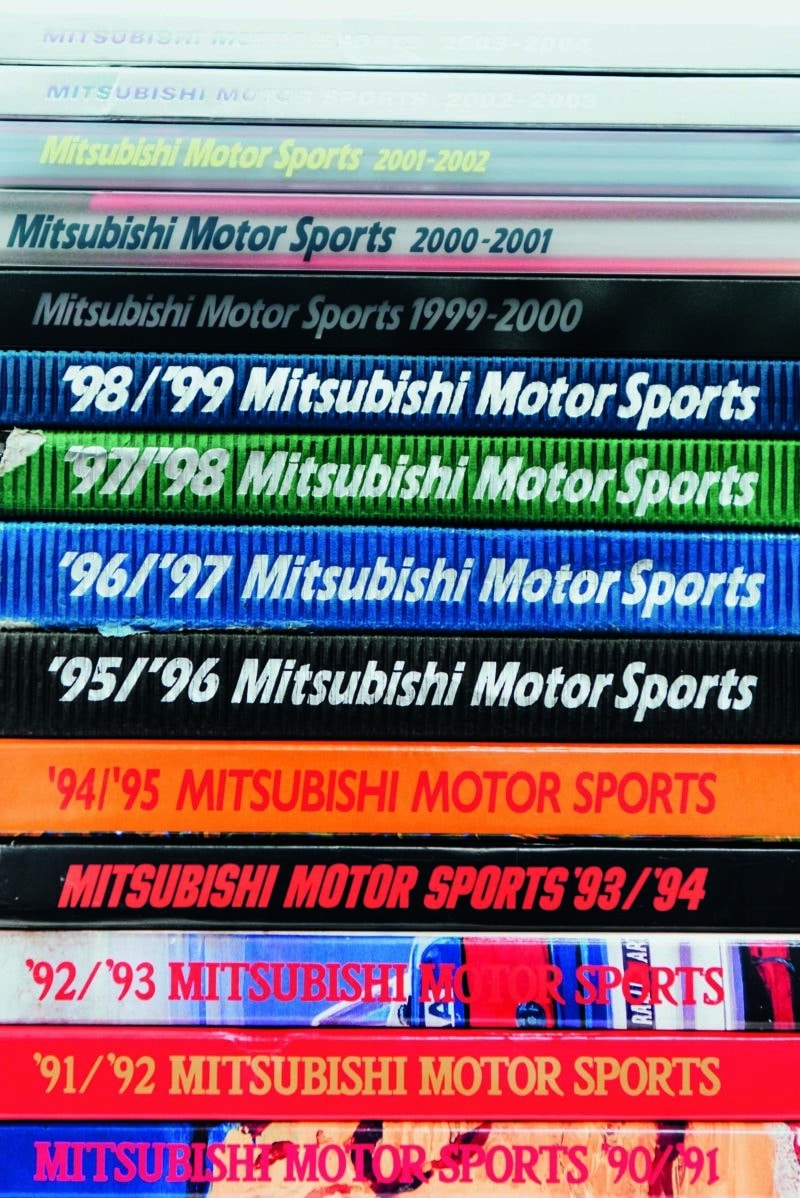 Stack of Mitsubishi motor sports books