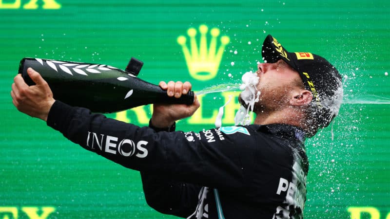 Valtteri Bottas sprays himself in the face with champagne at the 2021 Turkish Grand Prix