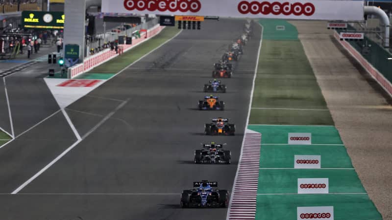 Fernando Alonso leads a line of cars at the 2021 Qatar Grand Prix