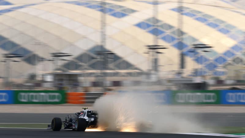 DOHA, QATAR - NOVEMBER 19: Sparks fly behind Pierre Gasly of France driving the (10) Scuderia AlphaTauri AT02 Honda during practice ahead of the F1 Grand Prix of Qatar at Losail International Circuit on November 19, 2021 in Doha, Qatar. (Photo by Clive Mason/Getty Images)