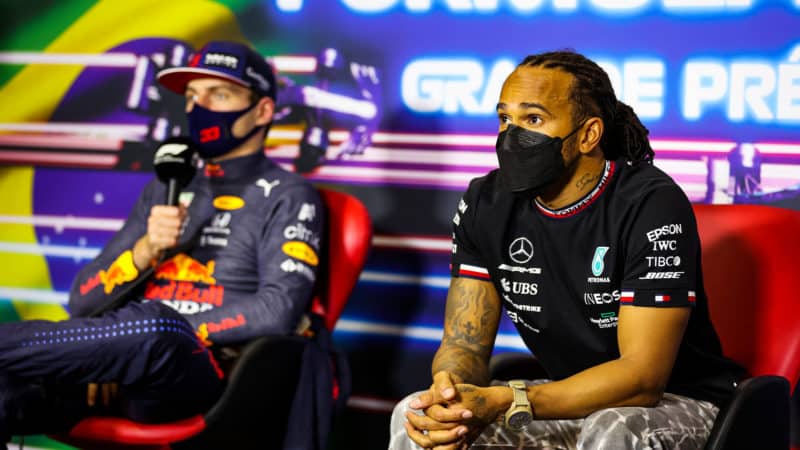 SAO PAULO, BRAZIL - NOVEMBER 14: Race Winner Lewis Hamilton of Great Britain and Mercedes G and second placed Max Verstappen of Netherlands and Red Bull Racing talk in the press conference after the F1 Grand Prix of Brazil at Autodromo Jose Carlos Pace on November 14, 2021 in Sao Paulo, Brazil. (Photo by Antonin Vincent - Pool/Getty Images)