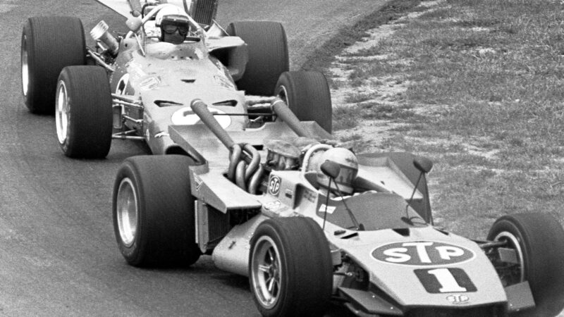 Mario Andretti leads AJ Foyt