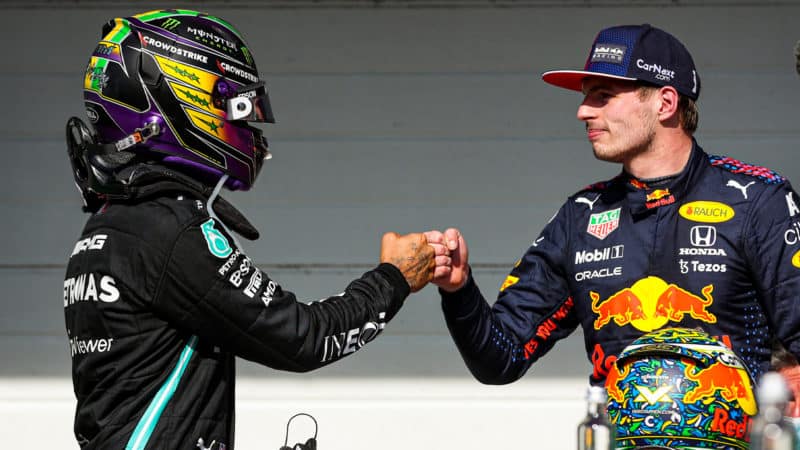 Max Verstappen and Lewis Hamilton bump fists after the 2021 Brazilian Grand Prix