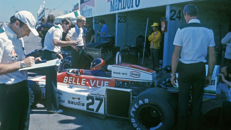 Patrick Neve in his Williams March-Ford during practice for the 1977 French Grand Prix in Dijon. On the left is team principal Frank Williams. Photo: Grand Prix Photo