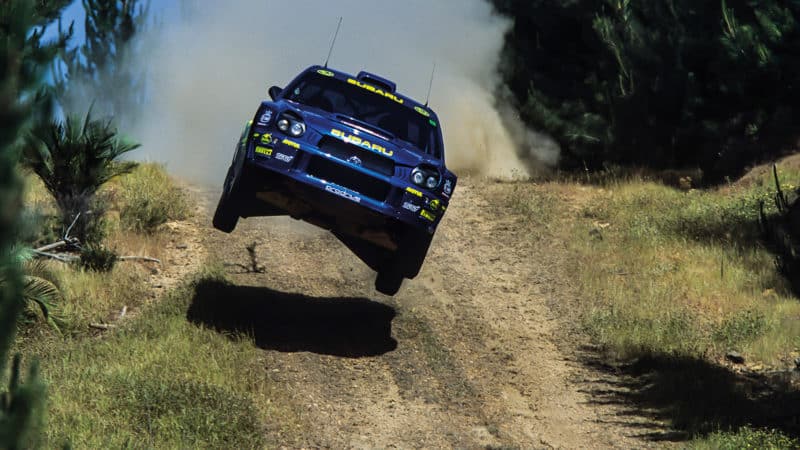 Subaru of Richard Burns off the ground after a jump in 2001 Australian Rally