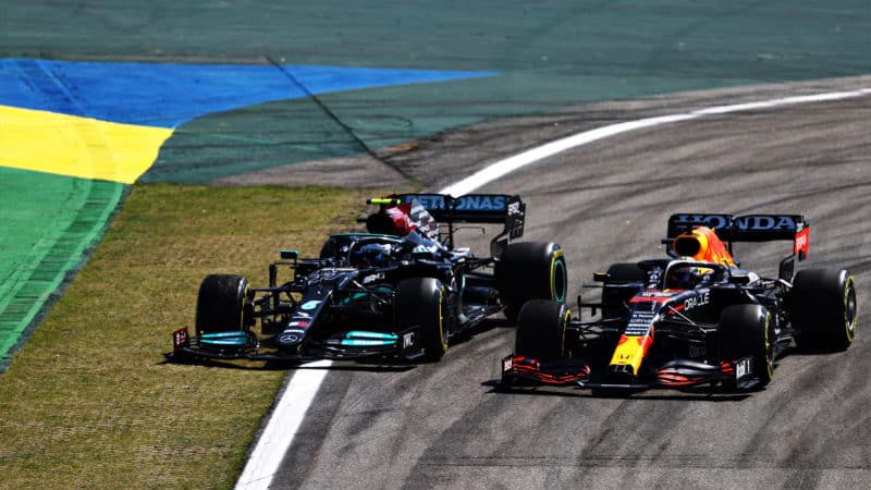 Valtteri Bottas runs wide on the outside of Max Verstappen at the 2021 Brazilioan Grand Prix