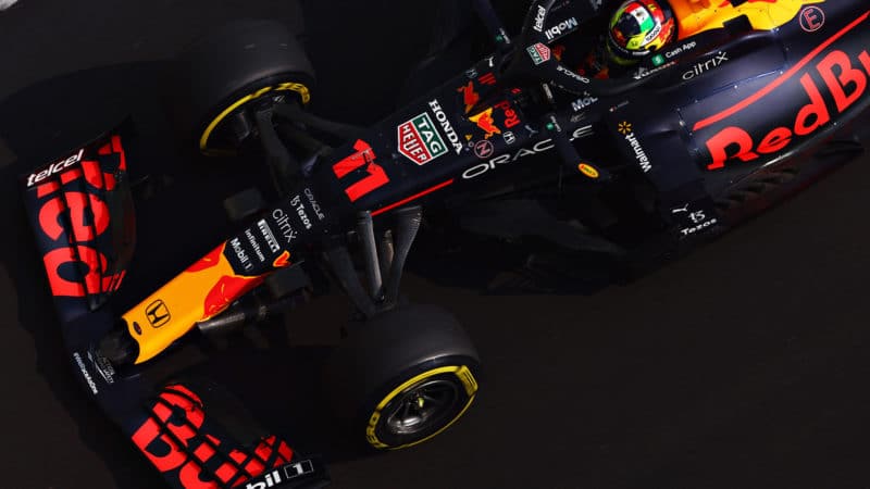 ABU DHABI, UNITED ARAB EMIRATES - DECEMBER 11: Sergio Perez of Mexico driving the (11) Red Bull Racing RB16B Honda during final practice ahead of the F1 Grand Prix of Abu Dhabi at Yas Marina Circuit on December 11, 2021 in Abu Dhabi, United Arab Emirates. (Photo by Mark Thompson/Getty Images)