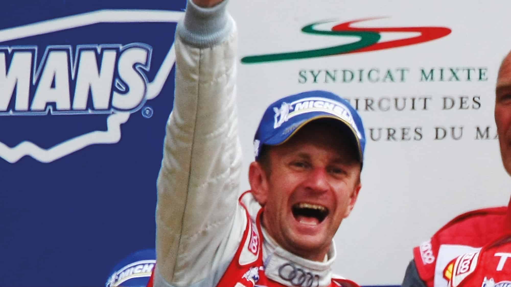 Allan McNish celebrates Le Mans victory