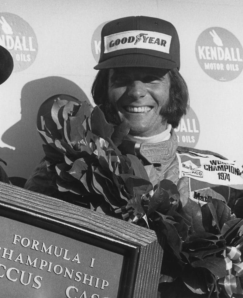 Emerson-Fittipaldi-on-the-podium-after-winning-the-1974-F1-title-at-Watkins-Glen