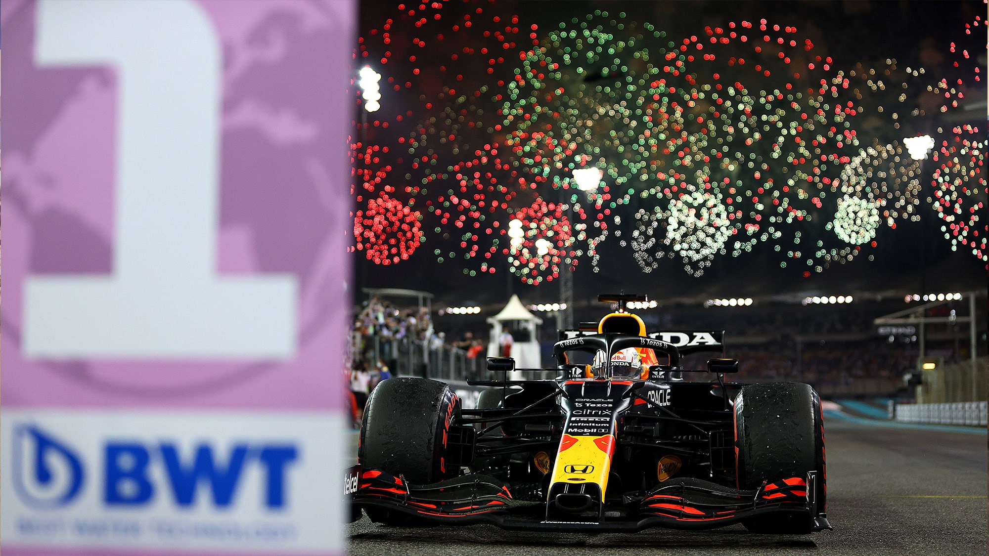 Fireworks behind Max Verstappen Red Bull after winning the 2021 F1 championship