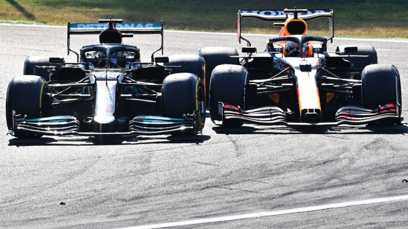 MONZA, ITALY - SEPTEMBER 12: Max Verstappen of the Netherlands driving the (33) Red Bull Racing RB16B Honda and Lewis Hamilton of Great Britain driving the (44) Mercedes AMG Petronas F1 Team Mercedes W12 crash during the F1 Grand Prix of Italy at Autodromo di Monza on September 12, 2021 in Monza, Italy. (Photo by Peter Van Egmond/Getty Images)