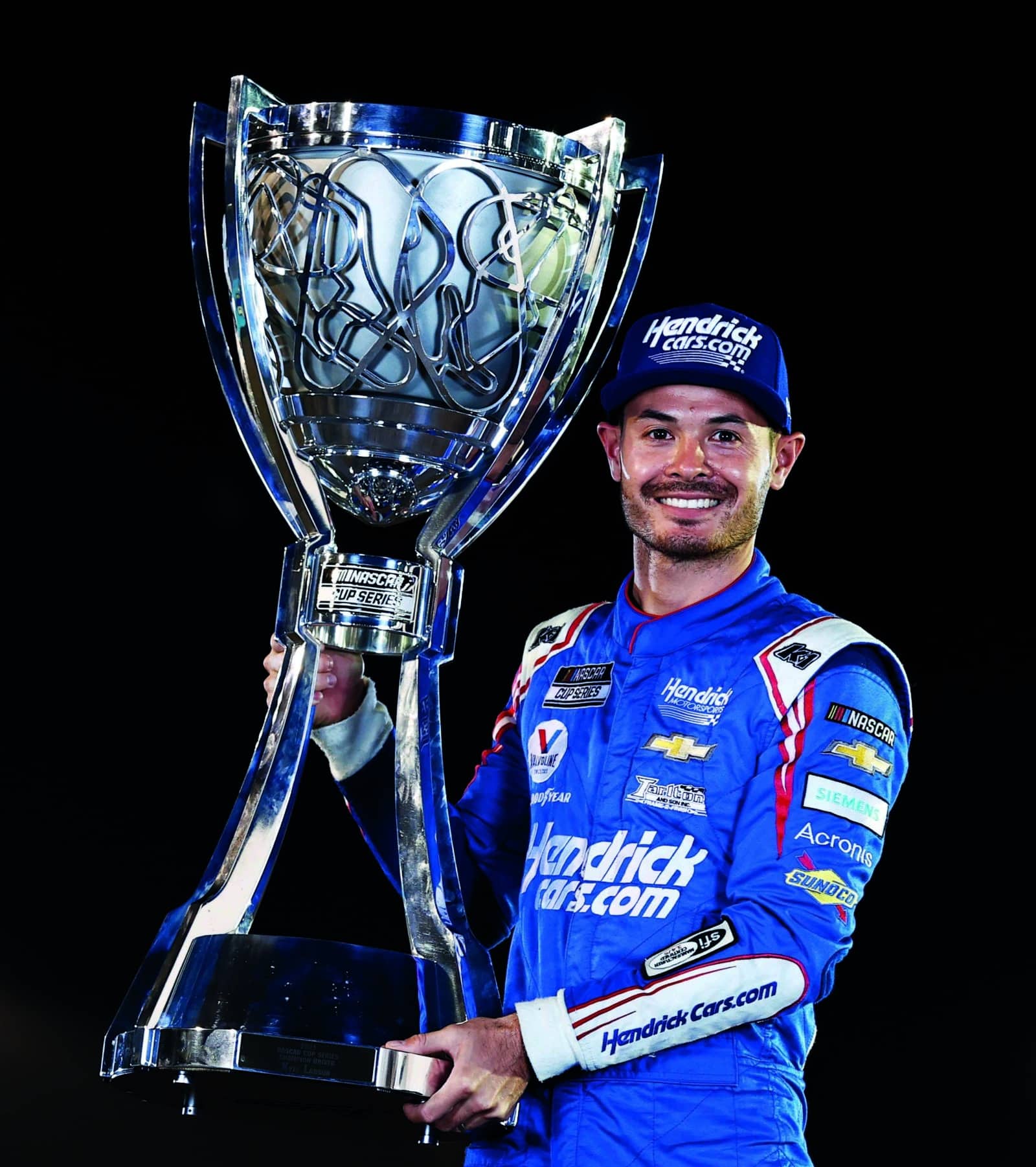 Kyle-Larson-with-NASCAR-Cup-Series-trophy
