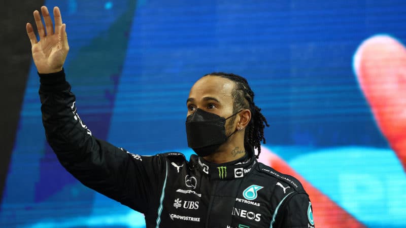 Lewis Hamilton waves on the podium at the 2021 Abu Dhabi Grand Prix