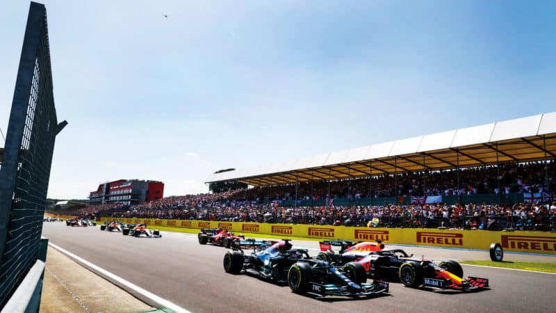 Max Verstappen and Lewis Hamilton side by side at the start of the 2021 British Grand Prix