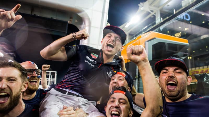 Max Verstappen celebrates winning the 2021 F1 championship with mechanics