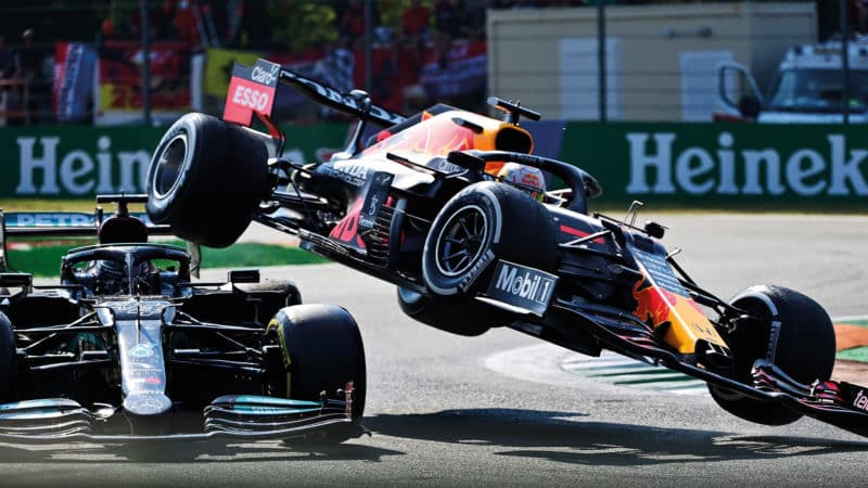 Red Bull of Max Verstappen is lifted into the air after hitting Lewis Hamilton Mercedes at Monza