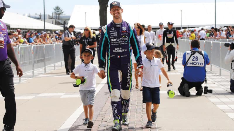 Romain Grosjean walks with his sons