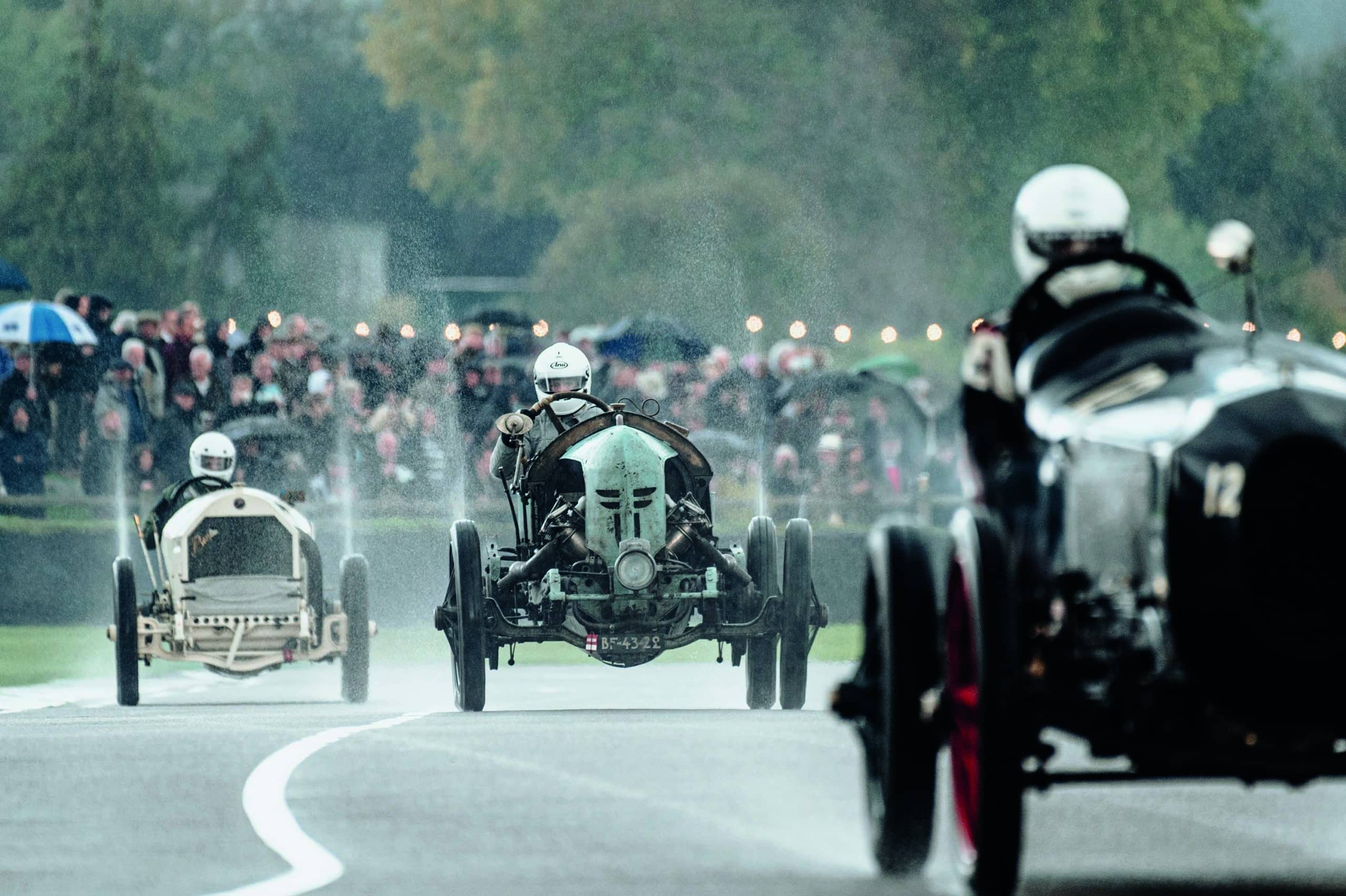 Spray-thrown-up-from-vintage-car-race-at-Goodwood-Members-Meeting
