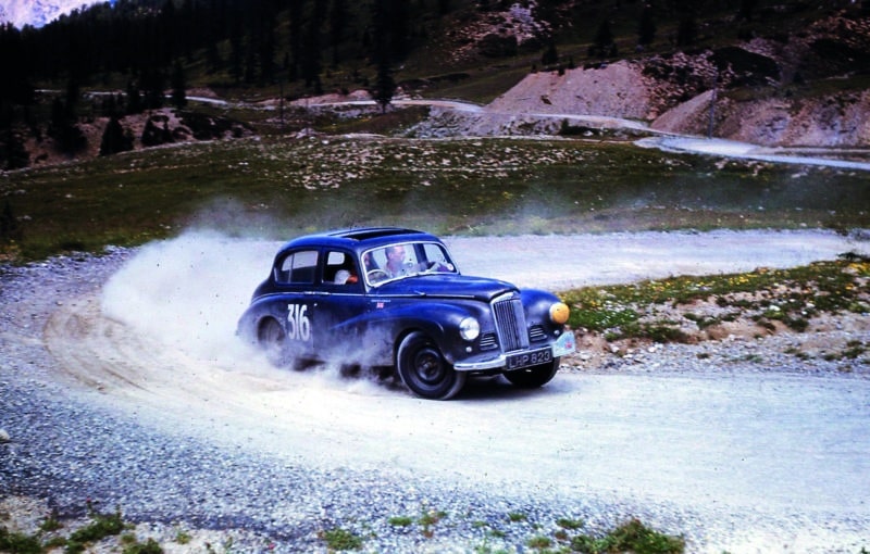 Stirling Moss creates a dust cloud with his Sunbeam on the 1952 Alpine Rally