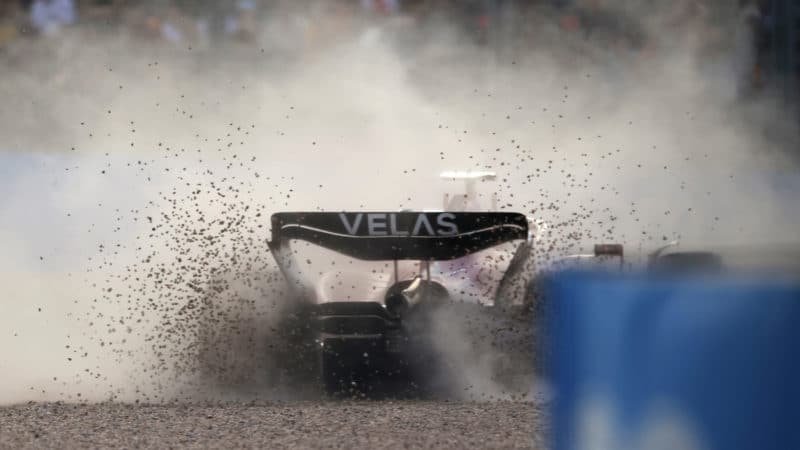 Carlos Sainz goes off in a shower of gravel at the 2022 Australian Grand Prix