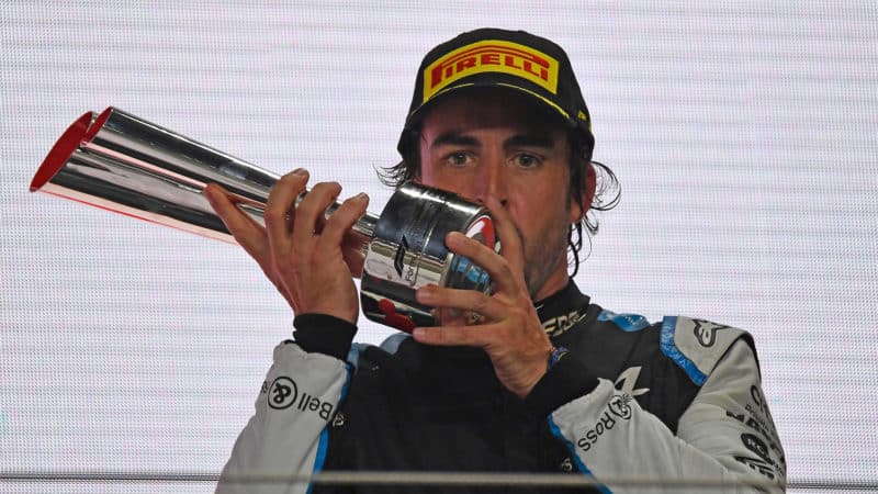 Fernando Alonso with trophy on the F1 podium at 2021 Qatar Grand Prix