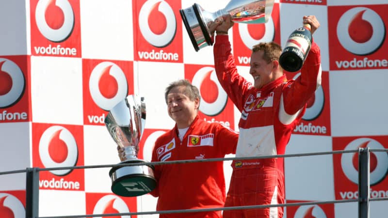 Jean Todt and Michael Schumacher on the Monza F1 podium in 2006