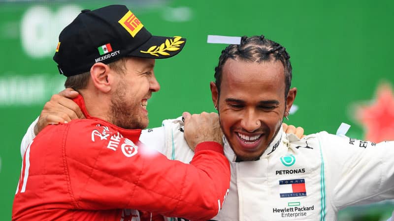 Sebastian Vettel on the F1 Mexican GP podium with Lewis Hamilton