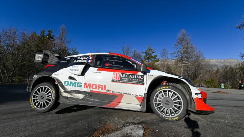 Toyota Yaris of Sebastien Ogier with a wheel off the ground in the 2022 Monte Carlo Rally