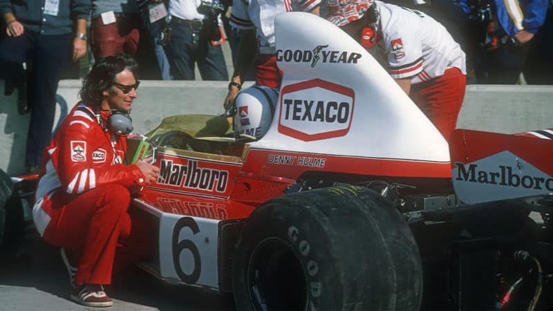 Denny Hulme and McLaren-Ford technical director Gordon Coppuck in the pits before the 1974 United States Grand Prix in Watkins Glen. Photo: Grand Prix Photo