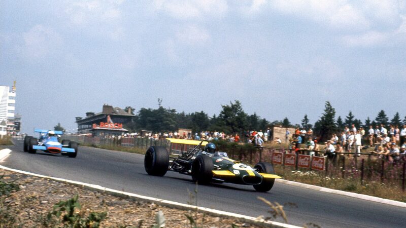 Jacky Ickx runs ahead of Johnny Servoz-Gavin at the Nurburgring in 1969