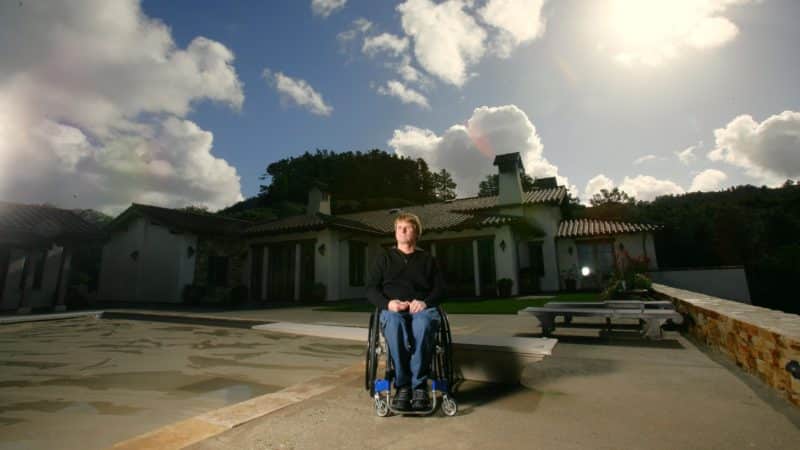 Wayne-Rainey-in-wheelchair-outside-his-house