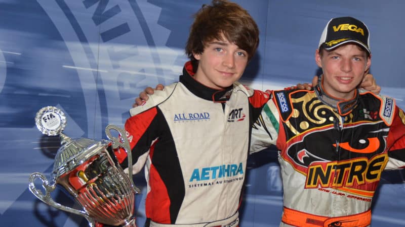 Charles Leclerc and Max Verstappen with karting trophy