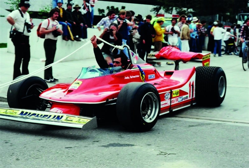 Ferrari of Jody Scheckter towed throuigh L-ong Beach paddock