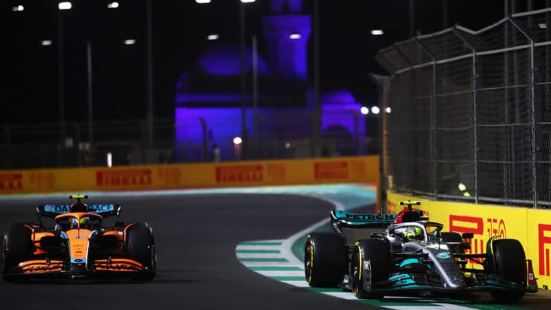 JEDDAH, SAUDI ARABIA - MARCH 25: Lewis Hamilton of Great Britain driving the (44) Mercedes AMG Petronas F1 Team W13 leads Lando Norris of Great Britain driving the (4) McLaren MCL36 Mercedes during practice ahead of the F1 Grand Prix of Saudi Arabia at the Jeddah Corniche Circuit on March 25, 2022 in Jeddah, Saudi Arabia. (Photo by Joe Portlock - Formula 1/Formula 1 via Getty Images)